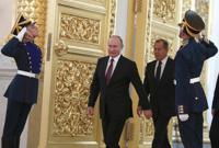 FILE - Russian President Vladimir Putin and Foreign Minister Sergei Lavrov walk past honour guards as they attend a ceremony to receive diplomatic credentials from newly appointed foreign ambassadors at the Kremlin in Moscow, Russia, Thursday, Oct. 11, 2018. In the wake of the 2022 invasion of Ukraine, U.S. sanctions are targeting Putin and a handful of individuals believed to be among his closest security advisers, including Lavrov. (Sergei Karpukhin/Pool Photo via AP, File)