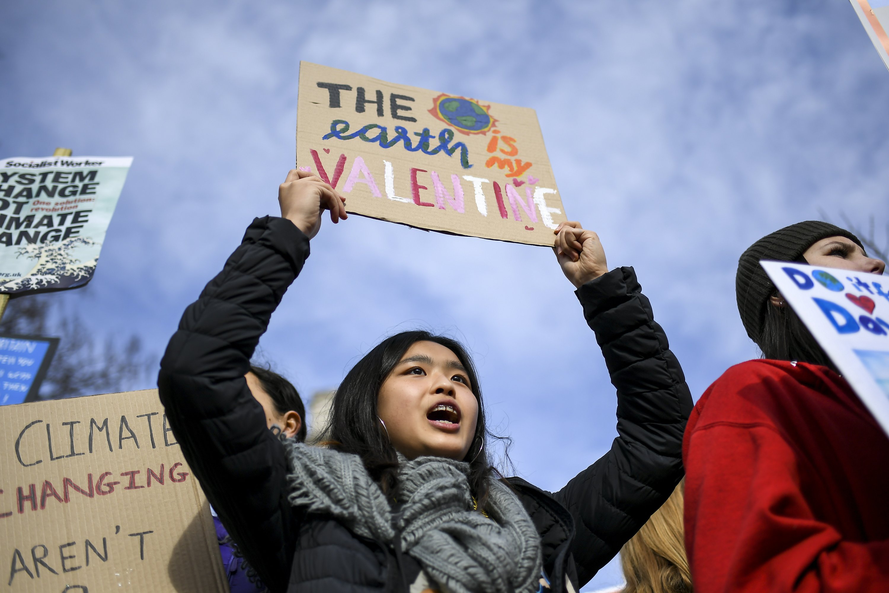 Climate change protest brings flares to London Fashion week - Associated Press