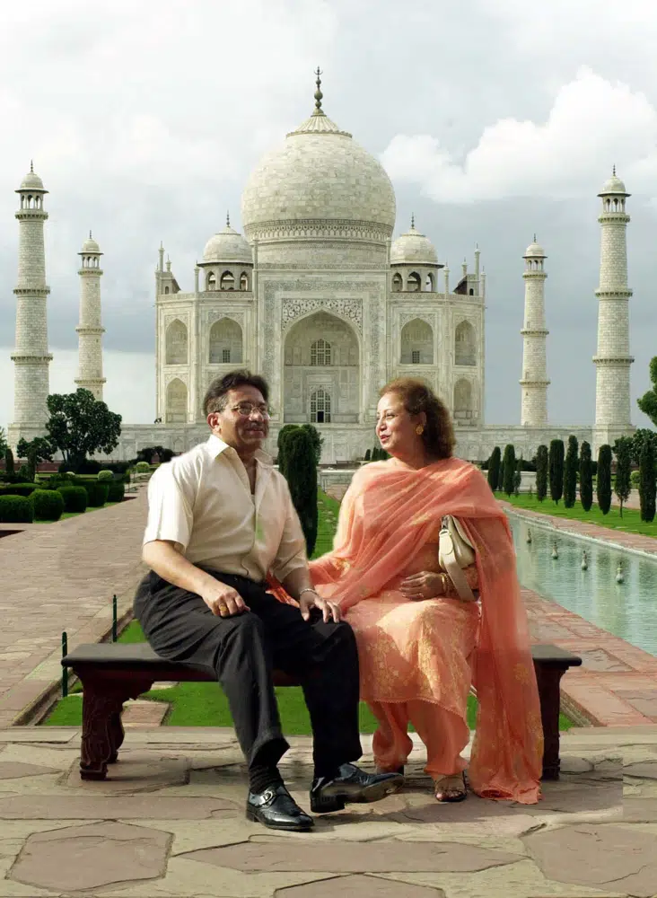 FILE - Pakistani President Gen. Pervez Musharraf and his wife Sehba pose in front of the Taj Mahal in Agra, India, on July 15, 2001. An official said Sunday, Feb. 5, 2023, Gen. Pervez Musharraf, Pakistan military ruler who backed U.S. war in Afghanistan after 9/11, has died. (AP Photo/Sherwin Crasto, File)