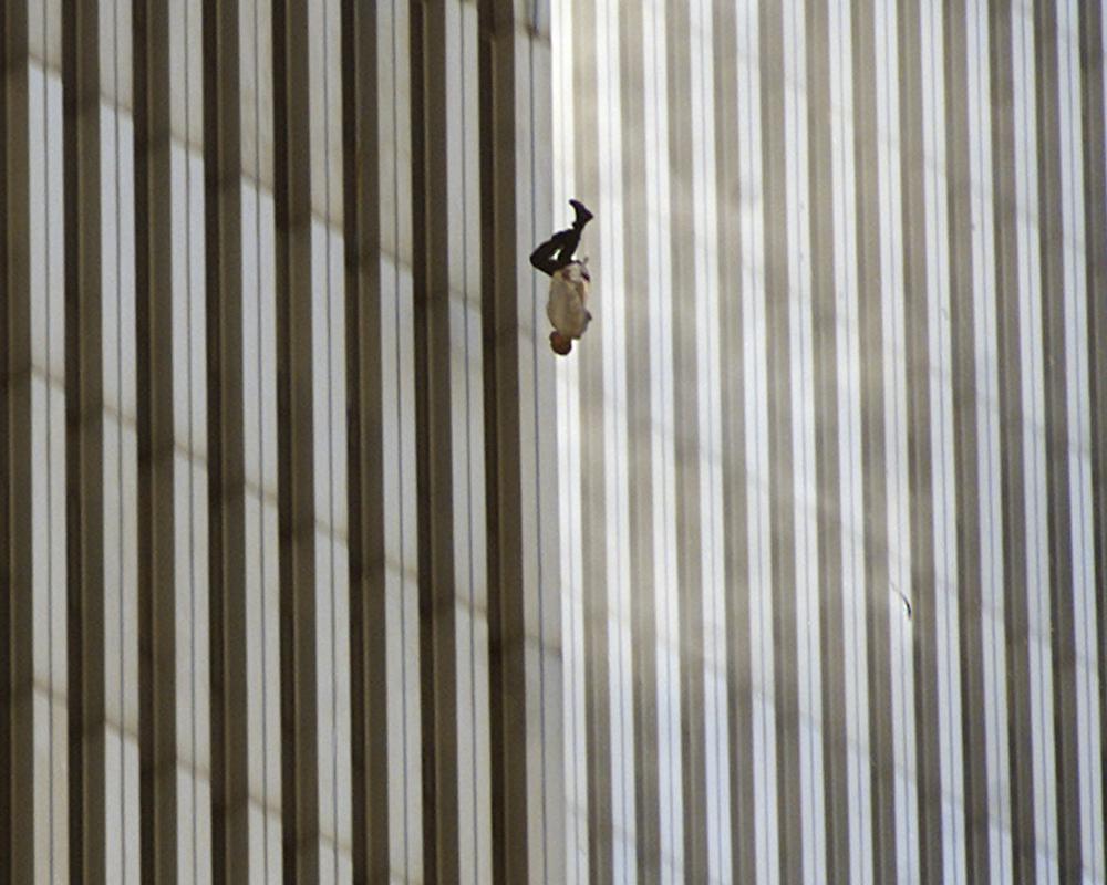 EDS NOTE: GRAPHIC CONTENT - FILE - A person falls from the north tower of New York's World Trade Center Tuesday Sept. 11, 2001after terrorists crashed two hijacked airliners into the World Trade Center and brought down the twin 110-story towers.  Associated Press photographer Richard Drew talks about AP’s coverage of 9/11 and the events that followed. (AP Photo/Richard Drew)