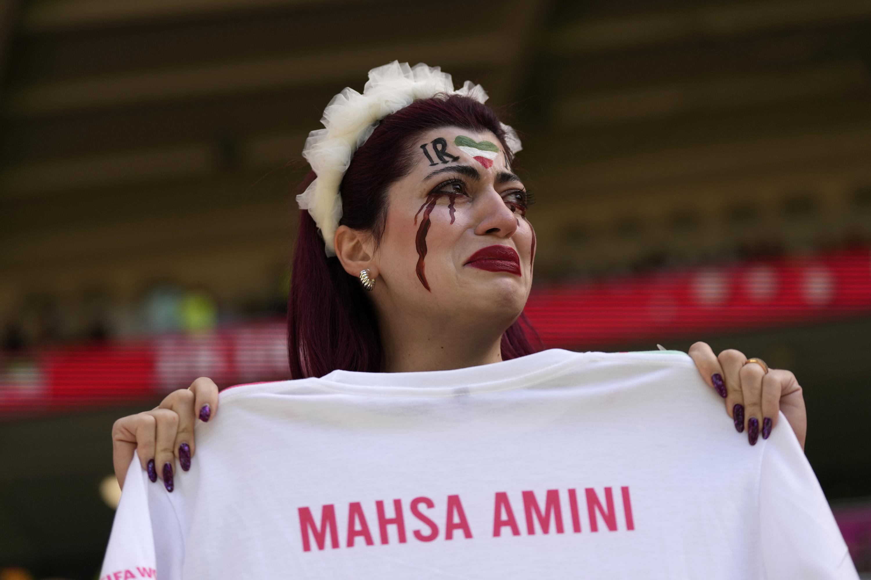 Barred from men's soccer games at home, Iranian women flock to World Cup in  Qatar