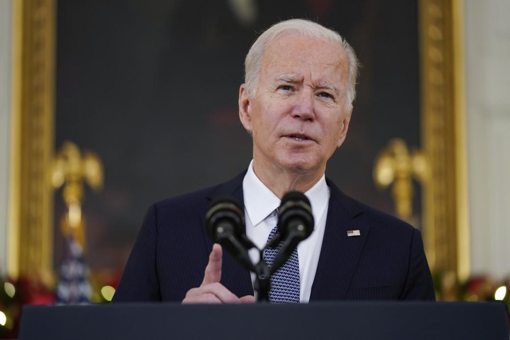 President Joe Biden delivers remarks on the November jobs report, in the State Dining Room of the White House, Friday, Dec. 3, 2021, in Washington. (AP Photo/Evan Vucci)