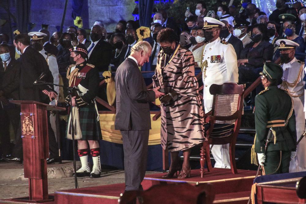 Barbados' new President Sandra Mason, center right, awards Prince Charles with the Order of Freedom of Barbados during the presidential inauguration ceremony in Bridgetown, Barbados on Tuesday Nov. 30, 2021. Barbados stopped pledging allegiance to Queen Elizabeth II on Tuesday as it shed another vestige of its colonial past and became a republic for the first time in history.(AP Photo / David McD Crichlow)