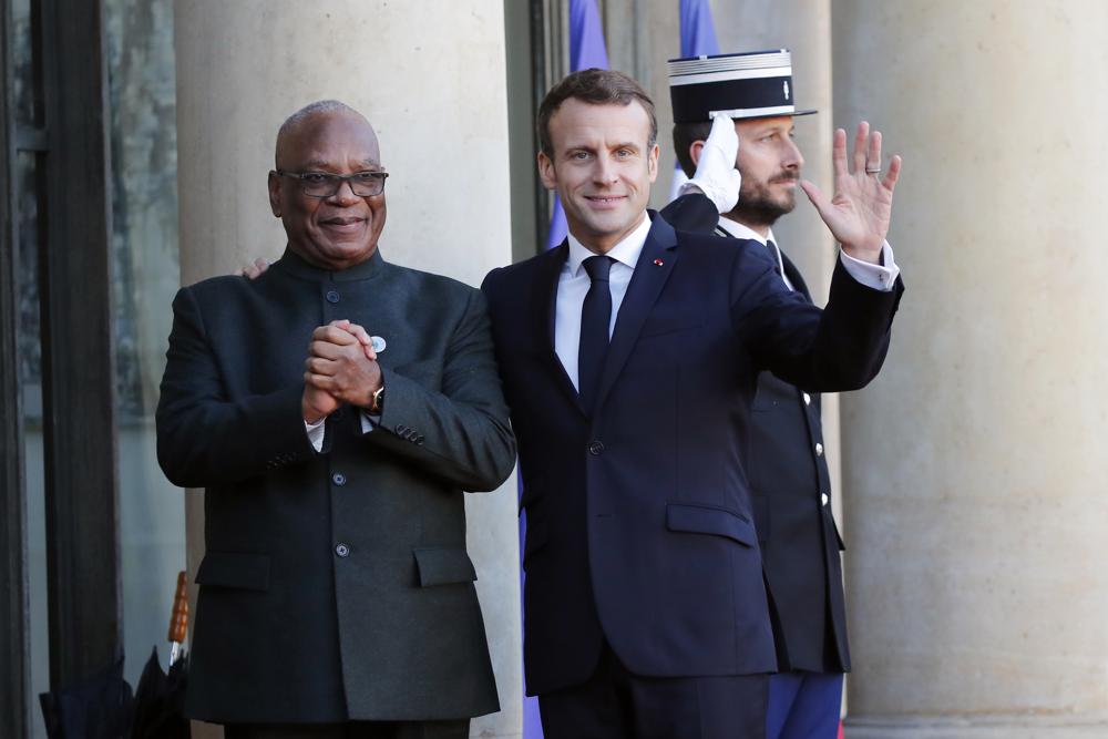 File - French President Emmanuel Macron welcomes Mali's President Ibrahim Boubacar Keita prior to their meeting at the Elysee Palace, in Paris Tuesday, Nov. 12, 2019. Mali's former president Ibrahim Boubacar Keita has died nearly 18 months after he was ousted in a military coup. Keita's death was announced Sunday, Jan. 16, 2022 in Bamako, where the 76-year-old had been battling health problems in recent years. (AP Photo/Francois Mori, File)