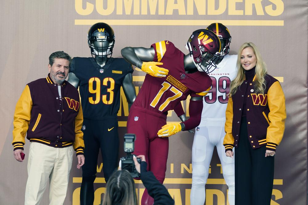 Dan and Tanya Snyder, co-owners and co-CEOs of the Washington Commanders, unveil their NFL football team's new identity, Wednesday, Feb. 2, 2022, in Landover, Md. The new name comes 18 months after the once-storied franchise dropped its old moniker following decades of criticism that it was offensive to Native Americans. (AP Photo/Patrick Semansky)