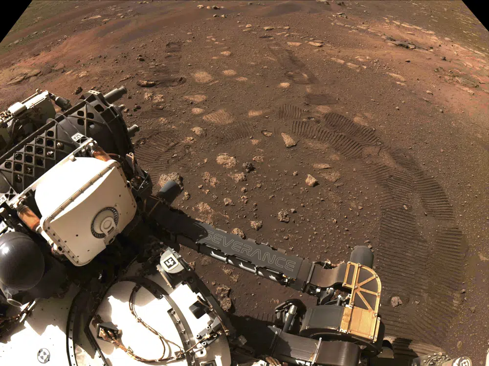 FILE - This photo made available by NASA was taken during the first drive of the Perseverance rover on Mars on March 4, 2021. A NASA rover on Mars by chance had its microphone on when a whirling tower of red dust passed overhead and caught the sound. Scientists released the first-of-its-kind audio Tuesday, Dec. 13, 2022. (NASA/JPL-Caltech via AP, File)