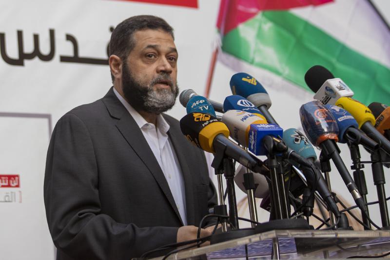 Senior Hamas official Osama Hamdan speaks during a rally organized by Lebanon's militant Hezbollah group to express solidarity with the Palestinian people, in the southern suburb of Beirut, Lebanon, Monday, May 17, 2021.  Hamdan says he expects a cease-fire between the group’s Gaza branch and Israel within 24 hours, on Thursday, May 20.   He tells The Associated Press that Egypt and Qatar are mediating and that progress is being made. (AP Photo/Hassan Ammar)