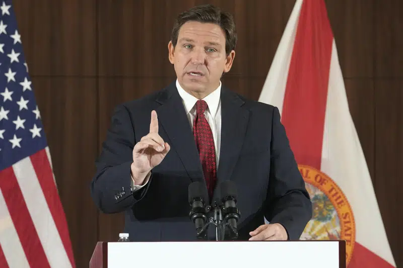 FILE - Florida Gov. Ron DeSantis gestures during a news conference, Thursday, Jan. 26, 2023, in Miami. DeSantis on Tuesday, Jan. 31, 2023, announced plans to block state colleges from having programs on diversity, equity and inclusion, and critical race theory. (AP Photo/Marta Lavandier, File)