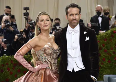 FILE - Blake Lively, left, and Ryan Reynolds attend The Metropolitan Museum of Art's Costume Institute benefit gala on Monday, May 2, 2022, in New York. Parties are back, and they've brought with them the potential for some dress code chaos. White tie, black tie, black tie creative/festive, semi-formal. Pre-pandemic guidelines for attire in an exhausted world more used to sweats and sneakers may take some extra re-entry energy. (Photo by Evan Agostini/Invision/AP, File)