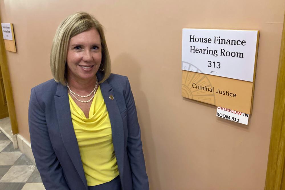 State Rep. Cindy Abrams, a Cincinnati Republican and former police officer, stands outside the Statehouse hearing room where her bill increasing punishments against violent protesters was approved on Wednesday, Nov. 10, 2021, in Columbus, Ohio. Abrams called the measure, approved by the GOP-controlled House Criminal Justice Committee along party lines, common sense legislation that supports people's right to peacefully assemble while punishing lawbreakers. (AP Photo/Andrew Welsh-Huggins)