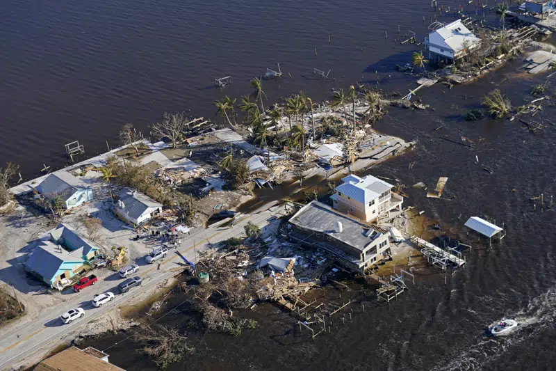 FILE - The bridge leading from Fort Myers to Pine Island, Fla., is seen heavily damaged in the aftermath of Hurricane Ian on Pine Island, Fla., on Oct. 1, 2022. Officials announced Tuesday, Dec. 6, that the Florida Legislature will meet next week for a special session on property insurance and property tax relief in the wake of damage caused by Hurricane Ian. (AP Photo/Gerald Herbert, File)