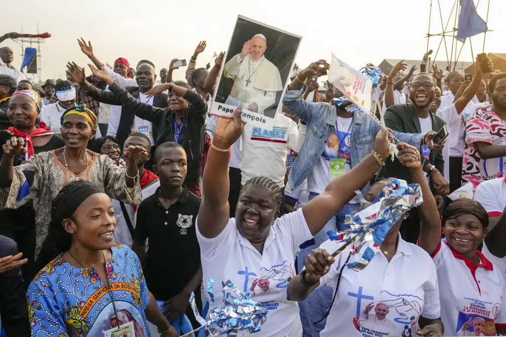 Faithful wait at Ndolo airport where Pope Francis will preside over the Holy Mass in Kinshasa, Congo, Wednesday Feb. 1, 2023. Francis is in Congo and South Sudan for a six-day trip, hoping to bring comfort and encouragement to two countries that have been riven by poverty, conflicts and what he calls a "colonialist mentality" that has exploited Africa for centuries. (AP Photo/Gregorio Borgia)