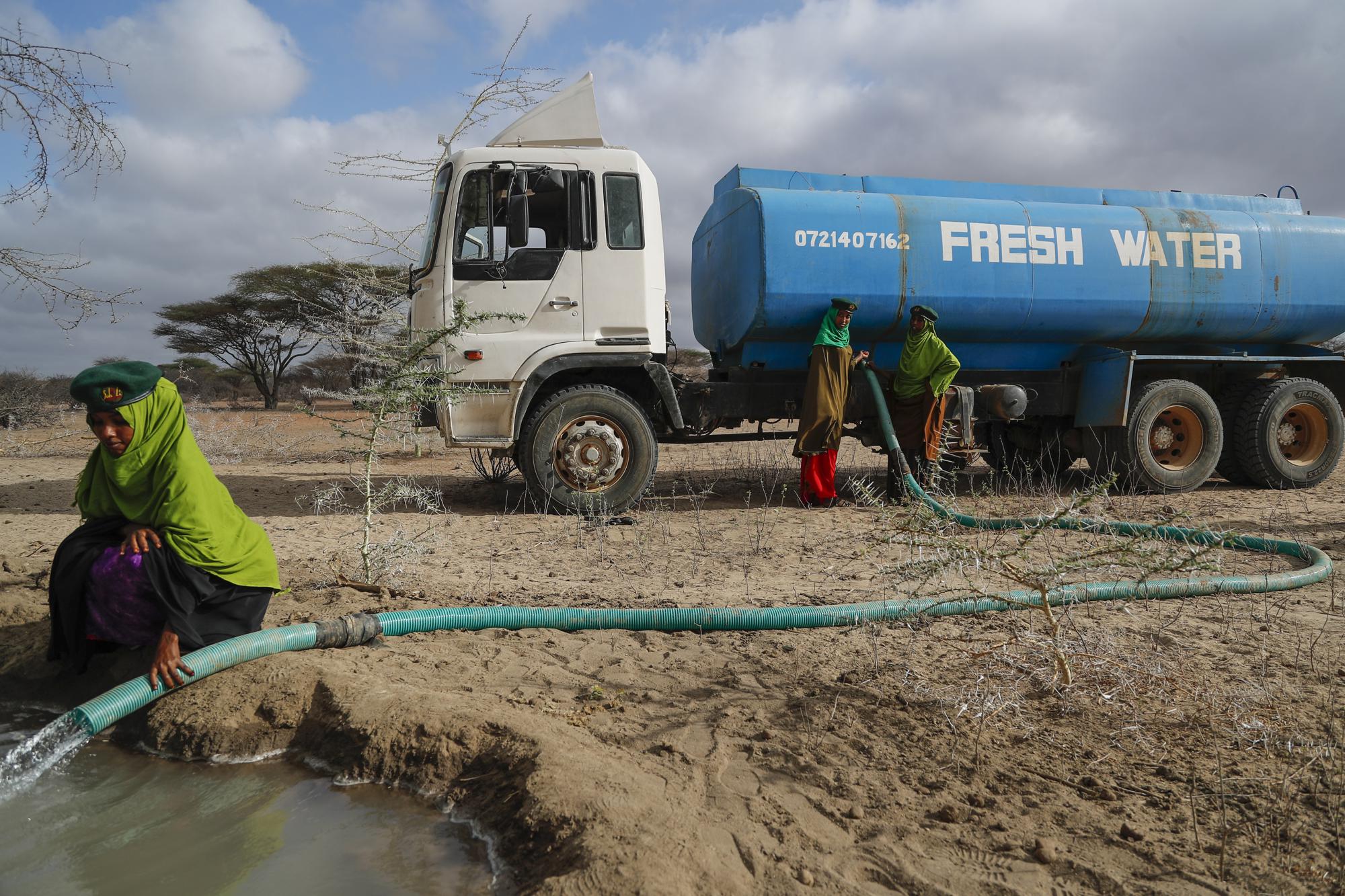 FILE - Rangers from the Sabuli Wildlife Conservancy supply water from a tanker for wild animals in the conservancy in Wajir County, Kenya, Oct. 26, 2021. The United Nations on Monday, Feb. 28, 2022, released a new report on climate change. (AP Photo/Brian Inganga, File)