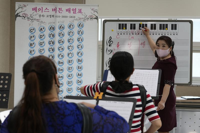 Ko Jeong Hee, right, a defector who teaches accordion, gives a lecture during the accordion class at the Inter-Korean Cultural Integration Center in Seoul, South Korea, on June 10, 2021. The center, which opened last year, is South Korea’s first government-run facility to bring together North Korean defectors and local residents to get to know each other through cultural activities and fun. It’s meant to support defectors’ often difficult resettlement in the South, but also aims at studying the possible blending of the rivals’ cultures should they unify. (AP Photo/Ahn Young-joon)
