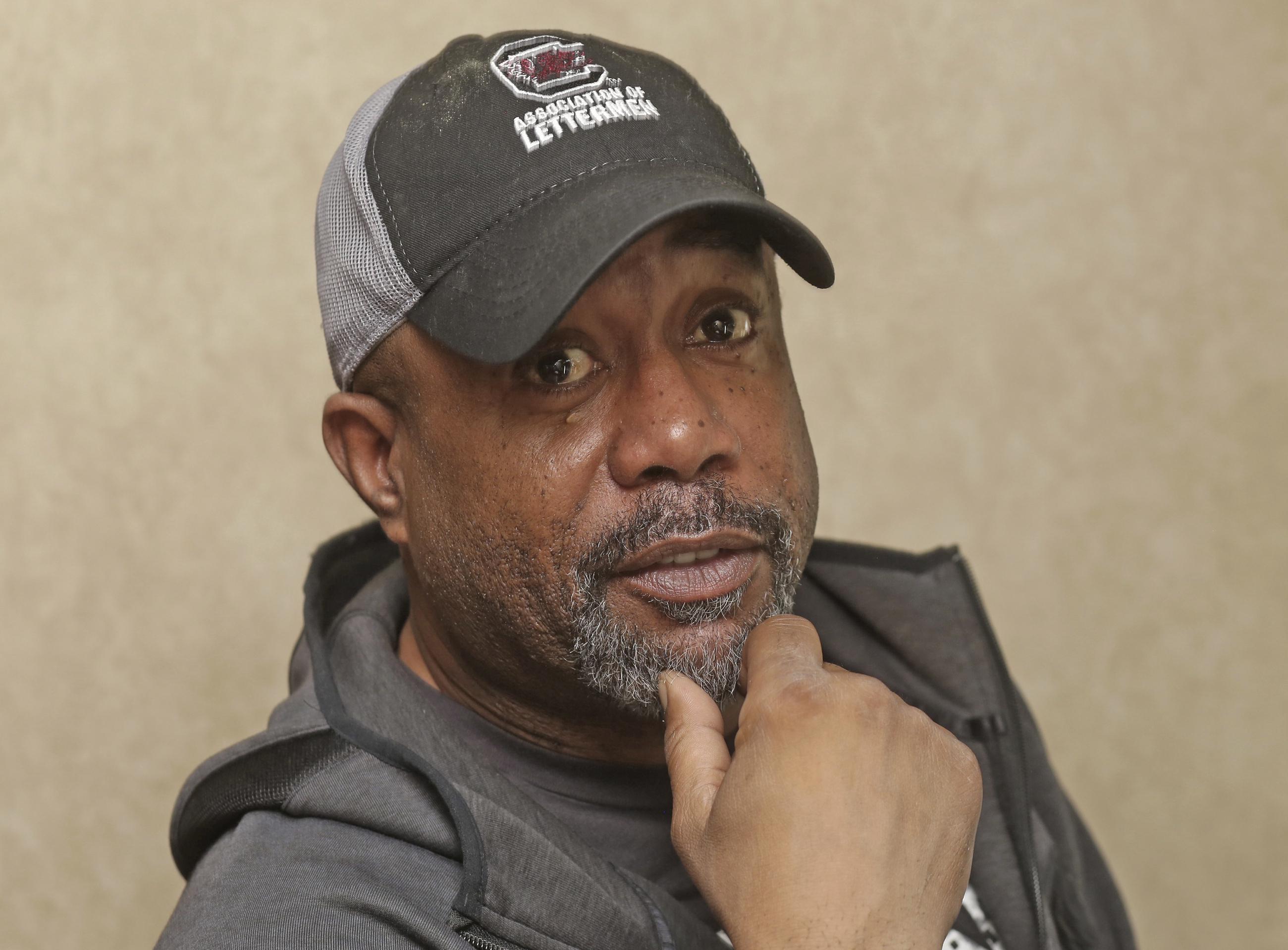 Darius Rucker knows teamwork critical in football and music AP News