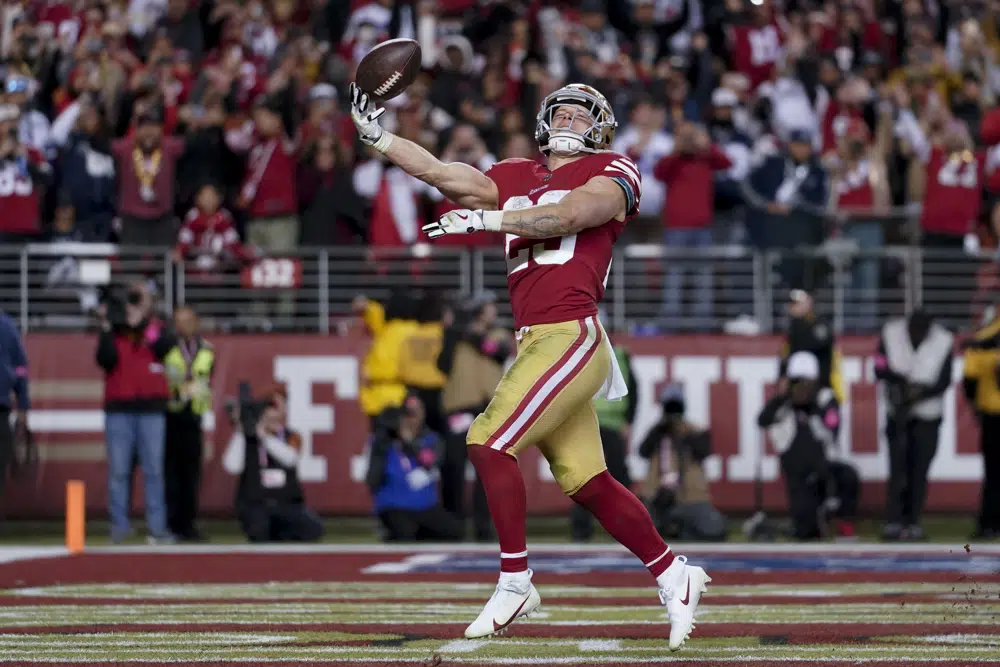 San Francisco 49ers running back Christian McCaffrey celebrates after scoring against the Dallas Cowboys during the second half of an NFL divisional playoff football game in Santa Clara, Calif., Sunday, Jan. 22, 2023. (AP Photo/Godofredo A. Vásquez)