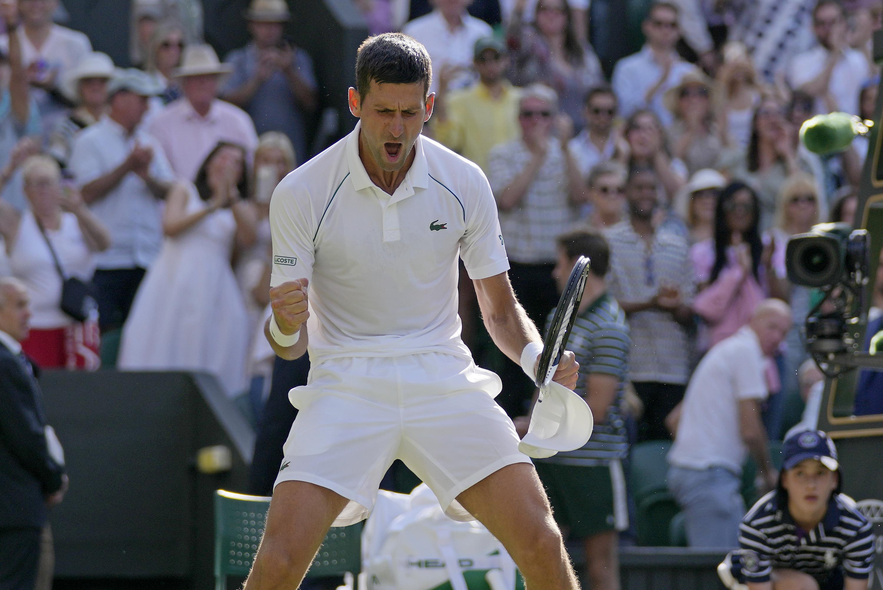 Djokovic - half volley, Novak Djokovic stretching to hit a …