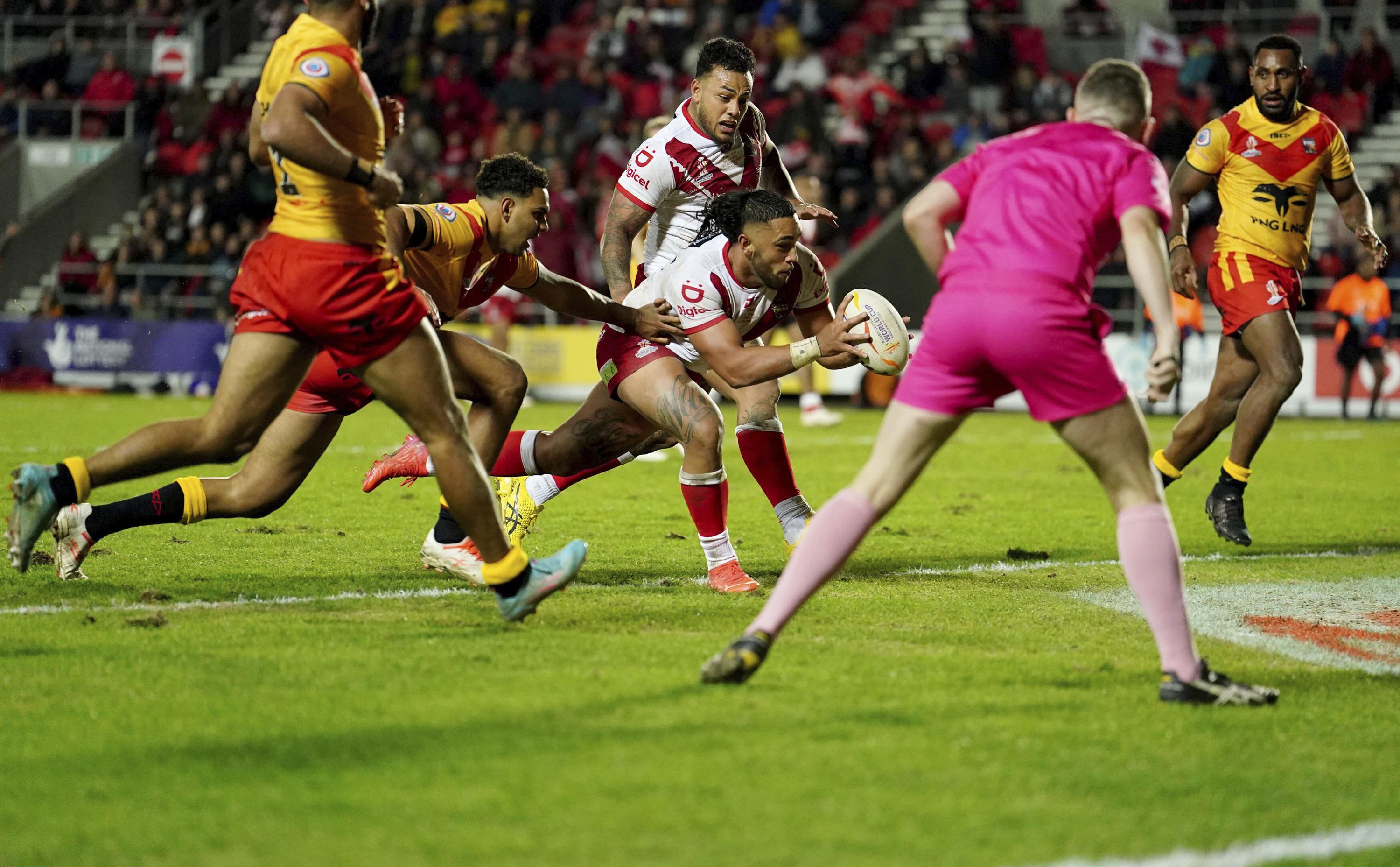 Tonga survives scare from PNG to win rugby league opener | AP News