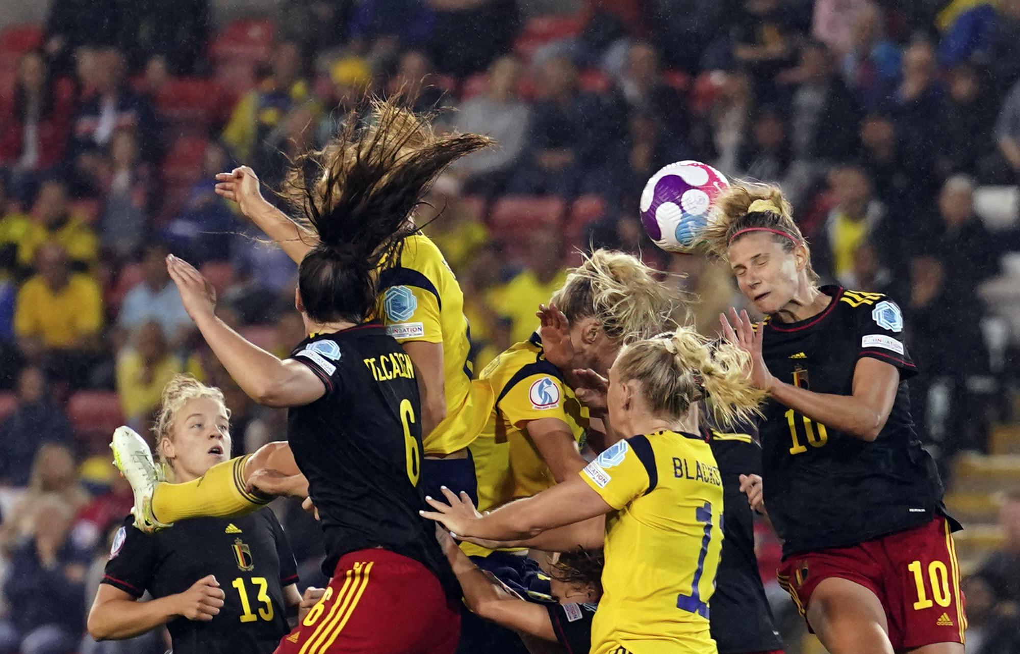 FILE - Belgium's Justine Vanhaevermaet, right, heads the ball during the Women Euro 2022 quarter final soccer match between Sweden and Belgium at Leigh Sports Village, in Leigh, Manchester, England, Friday, July 22, 2022. (AP Photo/Jon Super, File)