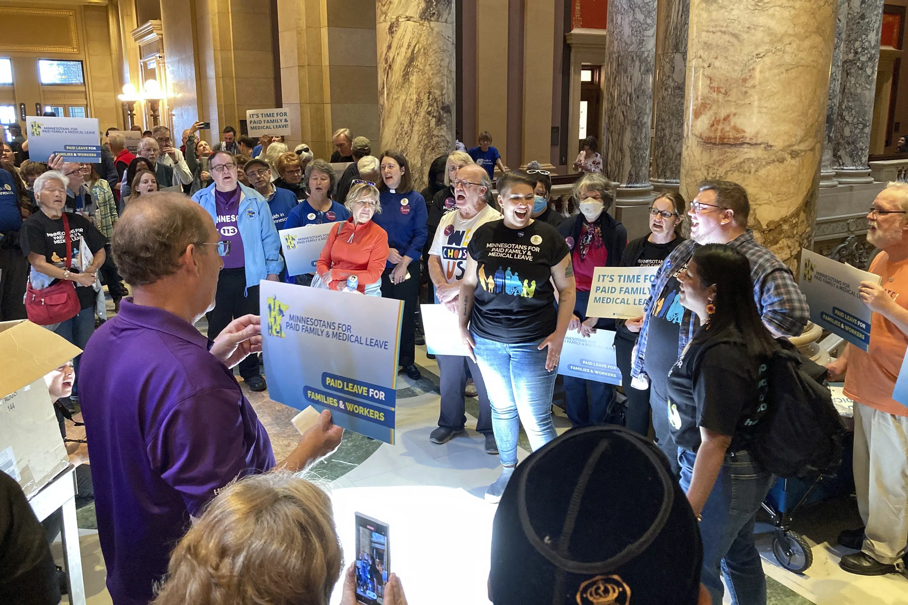 Minnesota governor signs paid family and medical leave act to give workers up to 20 weeks off Minnesota governor signs paid family and medical leave act to give workers up to 20 weeks off