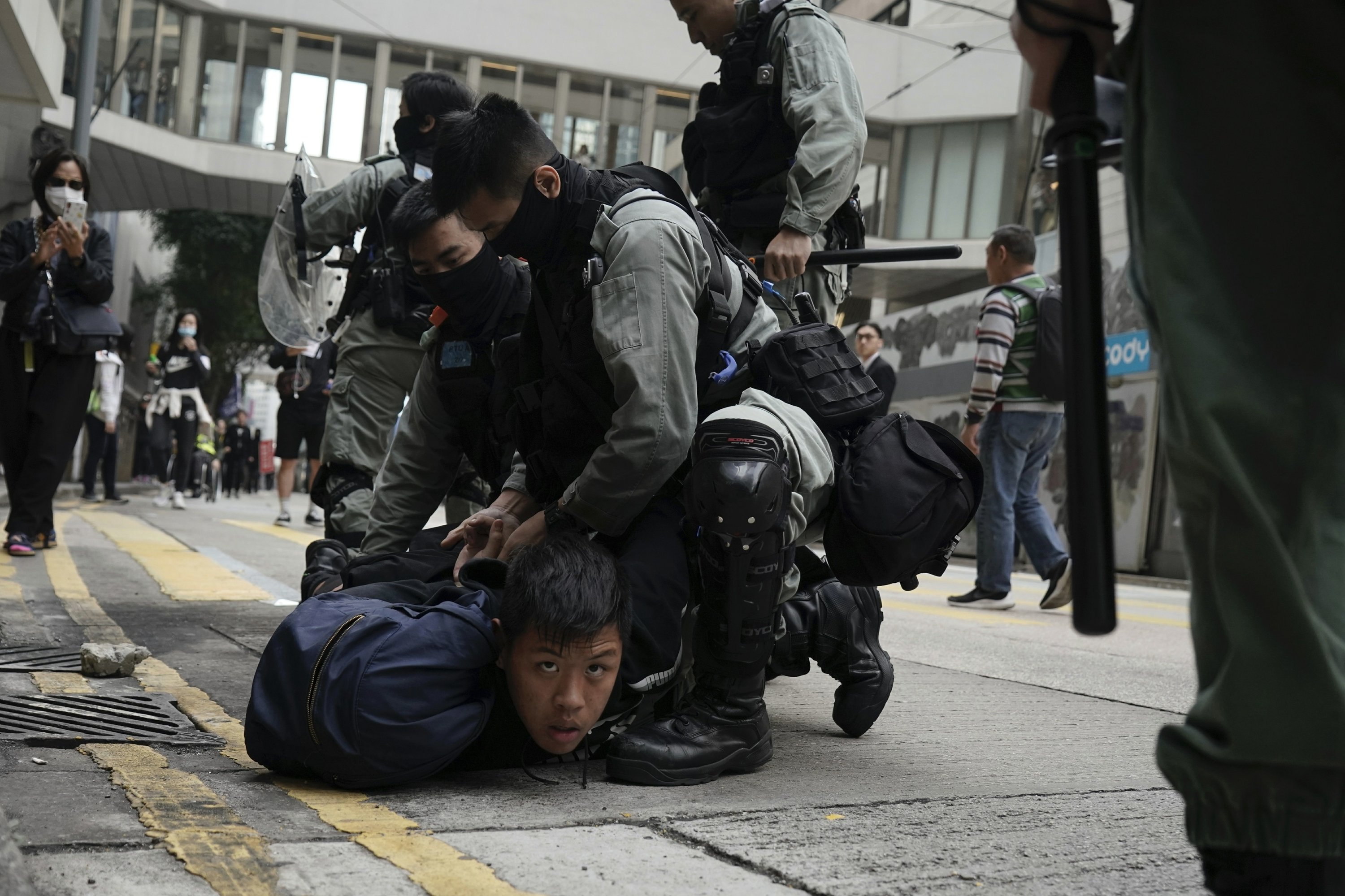 Clashes cut short Hong Kong rally as police officers are attacked