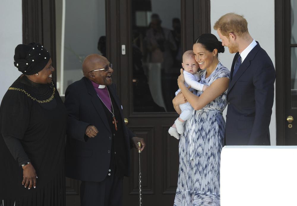 FILE - Britain's Prince Harry and Meghan, Duchess of Sussex, holding their son Archie, meet Anglican Archbishop Emeritus, Desmond Tutu and his wife Leah in Cape Town, South Africa, Wednesday, Sept. 25, 2019. South Africa’s Nobel Peace Prize-winning activist for racial justice and LGBT rights and the retired Anglican Archbishop of Cape Town, has died at the age of 90, it was announced on Sunday, Dec. 26, 2021. An uncompromising foe of apartheid, South Africa’s brutal regime of oppression again the Black majority, Tutu worked tirelessly, but non-violently, for its downfall. (Henk Kruger/African News Agency, Pool via AP, File)