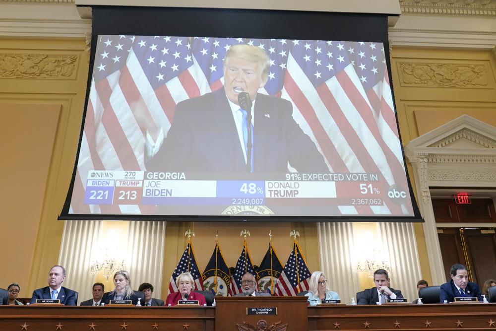 A video exhibit plays as the House select committee investigating the Jan. 6 attack on the U.S. Capitol continues to reveal its findings of a year-long investigation, at the Capitol in Washington, Monday, June 13, 2022. (AP Photo/Susan Walsh)