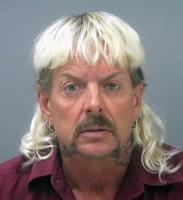 FILE - This undated file photo provided by the Santa Rose County Jail in Milton, Fla., shows Joseph Maldonado-Passage, also known as Joe Exotic. A federal judge in Oklahoma has set a Jan. 28, 2022, date for the resentencing of Exotic. A federal appeals court in July ruled that Exotic, should get a shorter sentence. The U.S. Court of Appeals for the 10th Circuit in Denver determined the trial court wrongly treated two murder-for-hire convictions separately in calculating his prison term. (Santa Rosa County Jail via AP, File)