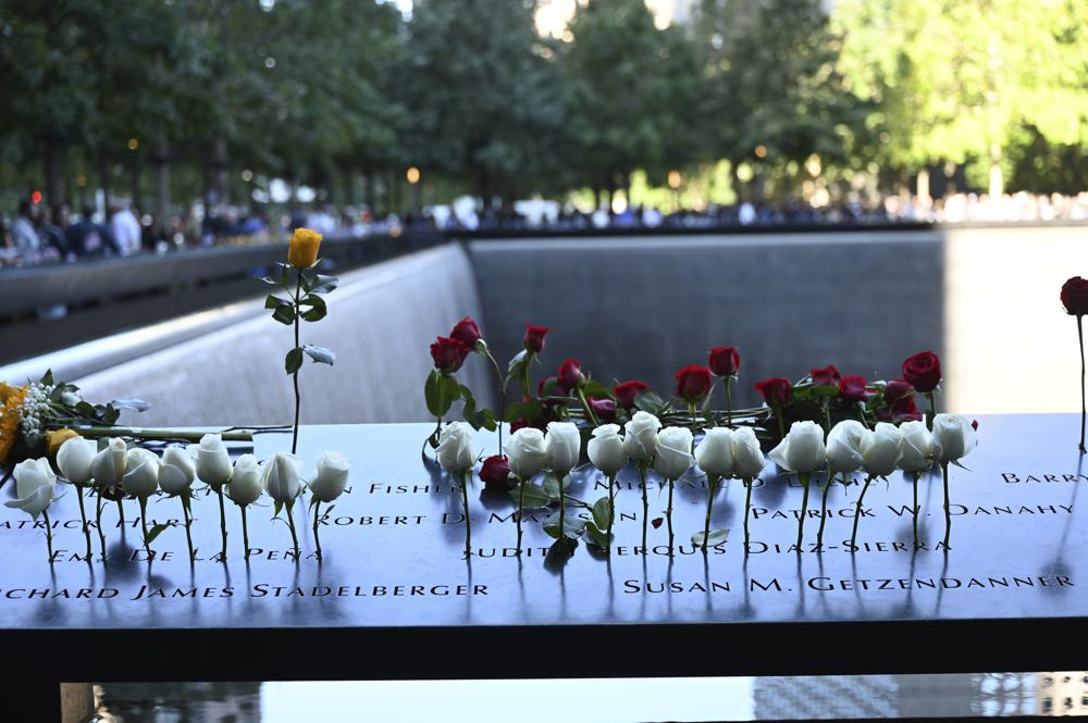 Flowers are seen at the National September 11 Memorial in New York on the 20th anniversary of the attacks, Saturday, Sept. 11, 2021. .(David Handschuh/Pool Photo via AP)