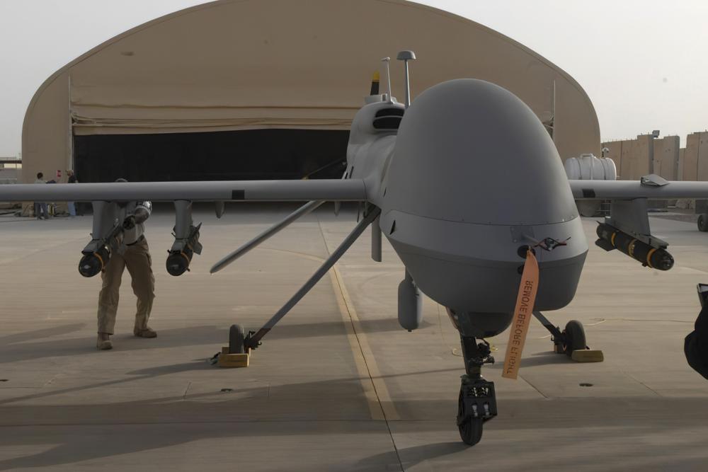 In this image provided by the U.S. Army, contactors from General Atomics load Hellfire missiles onto an MQ-1C Gray Eagle at Camp Taji, Iraq, on Feb. 27, 2011. AP/RSS Photo