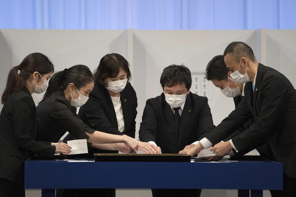 Votes are counted during the Liberal Democrat Party leadership election in Tokyo Wednesday, Sept. 29, 2021. Japan's governing party is voting to pick its new leader, with the presumed next prime minister facing imminent, crucial tasks such as addressing a pandemic-hit economy and ensuring a strong alliance with Washington amid growing regional security risks. (Carl Court/Pool Photo via AP)