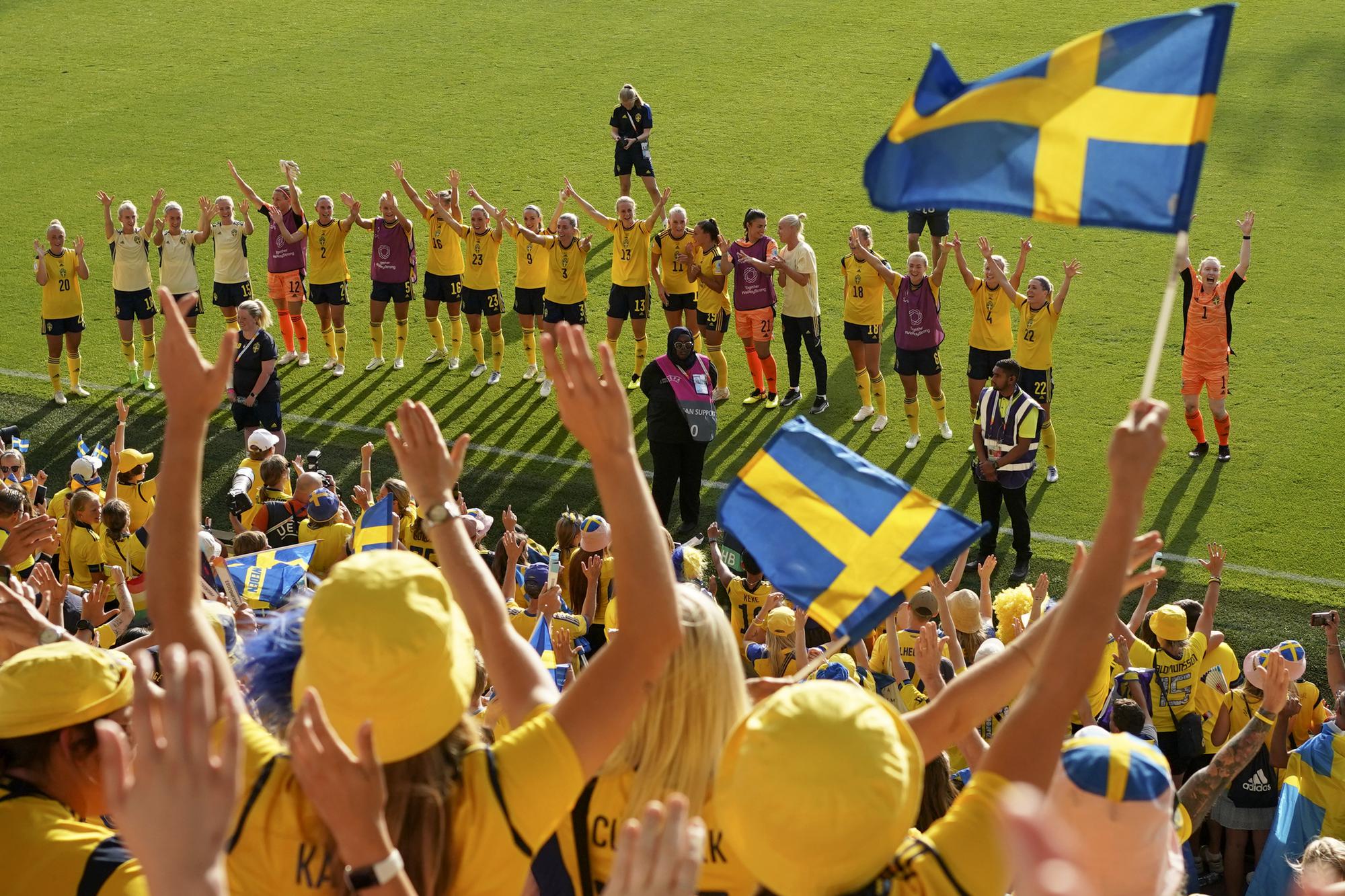 FILE - Sweden players celebrate with the fans at the end of the Women Euro 2022 group C soccer match between Sweden and Portugal at Leigh Sports Village, in Leigh, Manchester, England, Sunday, July 17, 2022. Sweden won 5-0 to advance to the quarterfinals. (AP Photo/Jon Super, File)