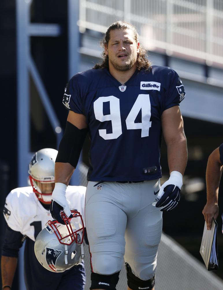 FILE - New England Patriots defensive lineman Markus Kuhn (94) walks on the field during an NFL football training camp practice Saturday, July 30, 2016, in Foxborough, Mass. Several German players have had success in the NFL. Sebastian Vollmer won two Super Bowl rings as an offensive lineman for the New England Patriots, protecting quarterback Tom Brady over an eight-year span. (AP Photo/Michael Dwyer, file)