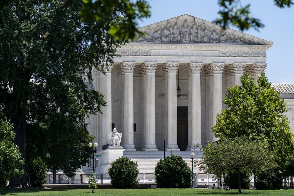 FILE - The Supreme Court is seen on Capitol Hill in Washington, July 14, 2022. The Supreme Court ruling expanding gun rights threatens to upend firearms restrictions across the country as activists wage court battles over everything from bans on AR-15-style guns to age limits. (AP Photo/J. Scott Applewhite, File)