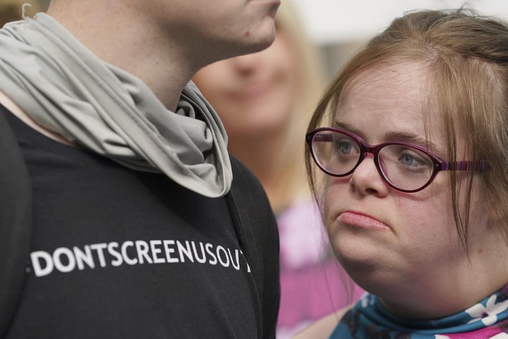 Campaigner Heidi Crowter looks on after speaking to the media after her court case, outside the High Court in London, Thursday, Sept. 23, 2021. A woman with Down’s syndrome has lost a court challenge against the British government over a law allowing the abortion up until birth of a foetus with the condition. Heidi Crowter, 26, and two others argued that part of the Abortion Act is discriminatory. Abortions in England, Wales and Scotland are allowed up till 24 weeks of pregnancy, but terminations can be allowed up until birth if there is “a substantial risk