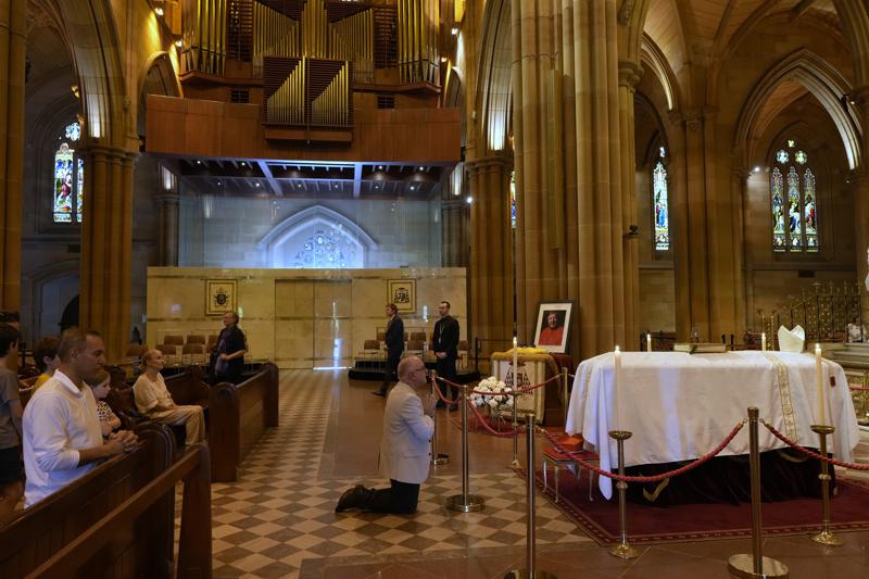 Pell mourned at Sydney cathedral day before funeral, protest