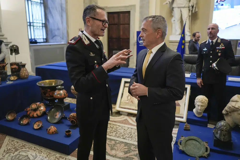 Carabinieri Commander Gen. Vincenzo Molinese, left, talks with Col. Matthew Bogdans from the District Attorney's office of Manhattan at a press conference in Rome, Monday, Jan. 23, 2023. The stolen artifacts, for an estimated total value of 20 million dollars, have been recovered in private collections in the US and returned to Italy after a joint investigation by Italian Carabinieri police and the New York County District Attorney's Office. (AP Photo/Andrew Medichini)