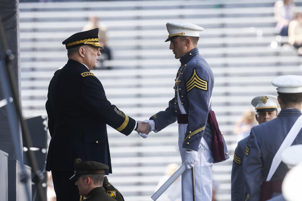 Mark A. Milley, Chairman of the Joint Chiefs of Staff, shakes the hands of West Point graduates as they receive their diplomas during the graduation ceremony of the U.S. Military Academy class of 2022 at Michie Stadium on Saturday, May 21, 2022, in West Point, N.Y. (AP Photo/Eduardo Munoz Alvarez)