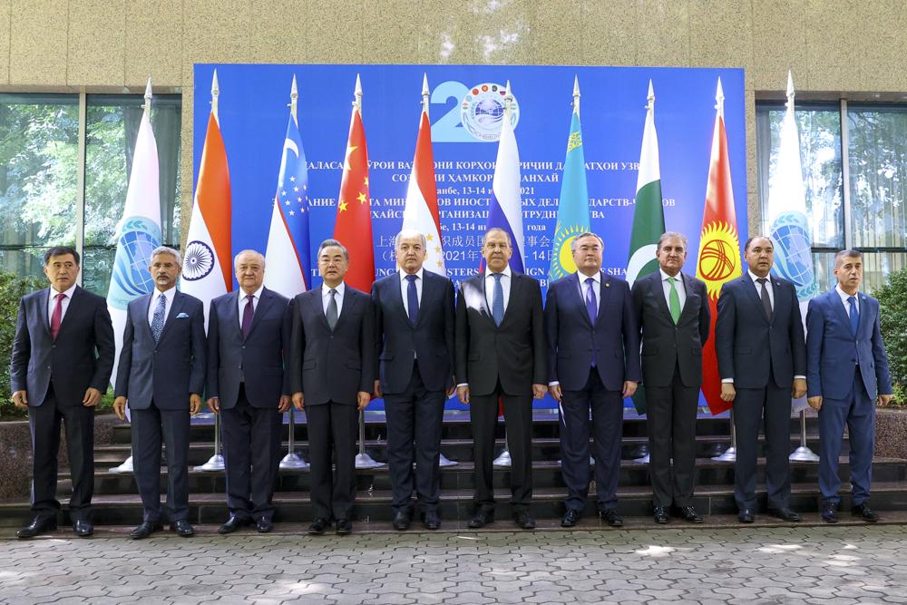 This photo released by Russian Foreign Ministry Press Service, shows from left, SCO Secretary-General Vladimir Norov, Indian Foreign Minister Subrahmanyam Jaishankar, Uzbekistani Foreign Minister Abdulaziz Kamilov, Chinese Foreign Minister Wang Yi, Tajiki Foreign Minister Sirojiddin Muhriddin, Russian Foreign Minister Sergey Lavrov, Kazakhstan's Foreign Minister Mukhtar Tileuberdi, Pakistani Foreign Minister Shah Mahmood Qureshi, Kyrgyz Deputy Foreign Minister Nuran Niyazaliev and SCO Regional Anti-Terrorist Structure (RATS) Executive Committee Director Jumakhon Giyosov pose for a photo prior to the Shanghai Cooperation Organization (SCO) meeting in Dushanbe, Tajikistan, Wednesday, July 14, 2021. Foreign ministers from Shanghai Cooperation Organisation member states hold a series of meetings in the Tajik capital Dushanbe to discuss regional issues, including the security situation in Afghanistan.