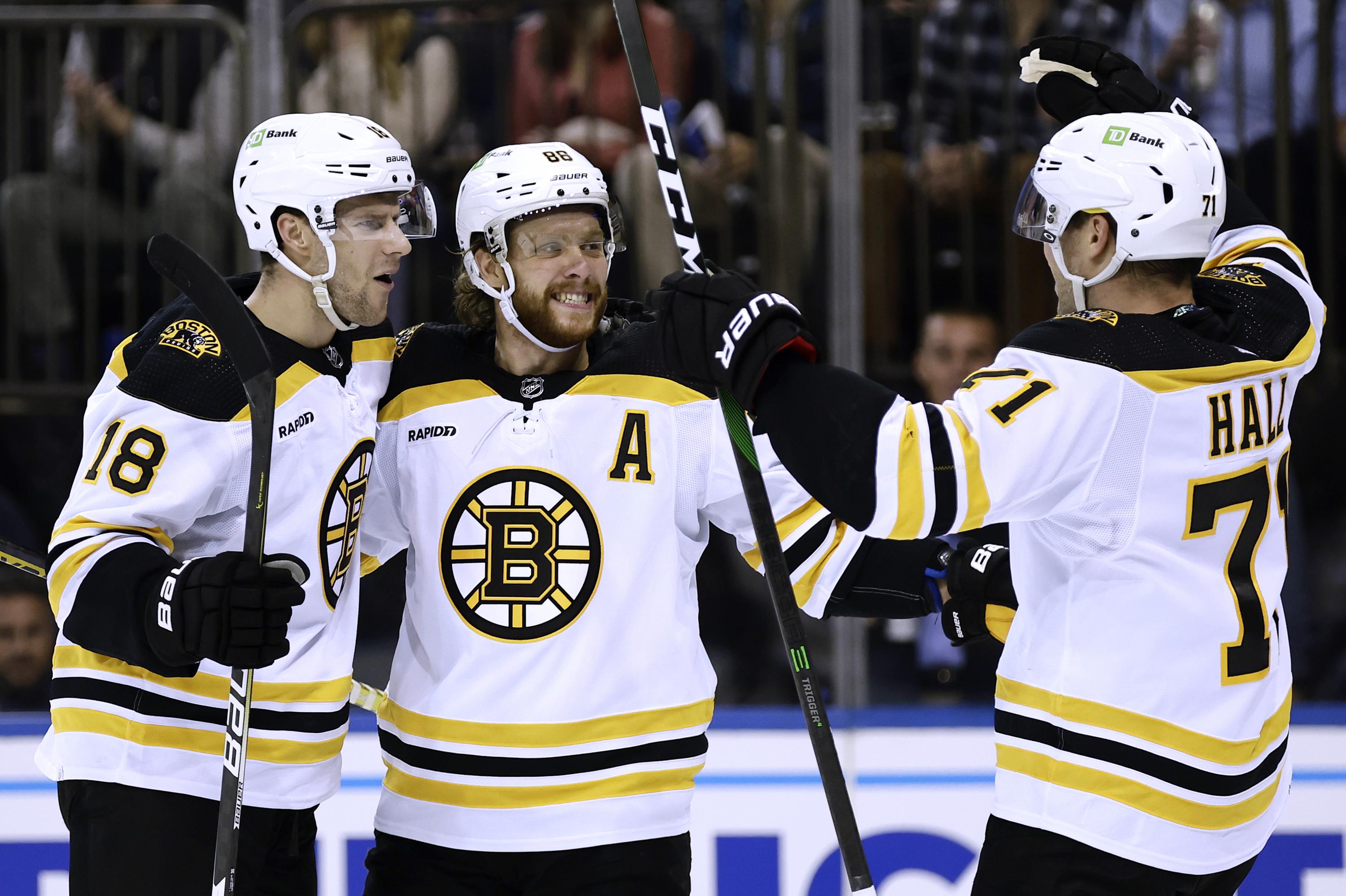 Bruins score 4 in 3rd, beat Rangers 52 for 7th straight AP News