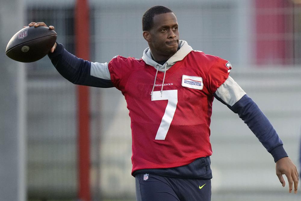 Seattle Seahawks quarterback Geno Smith throws a ball during a practice session in Munich, Germany, Thursday, Nov. 10, 2022. The Tampa Bay Buccaneers are set to play the Seattle Seahawks in a NFL game at the Allianz Arena in Munich on Sunday. (AP Photo/Matthias Schrader)