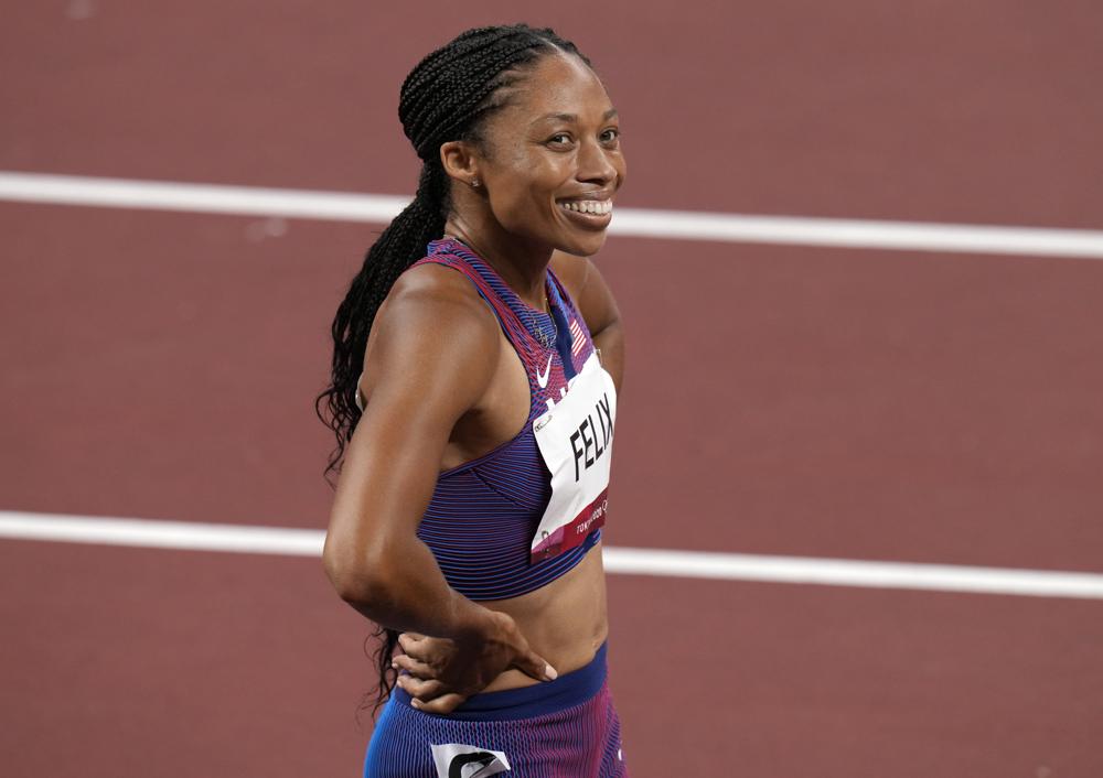 Allyson Felix, of United States smiles after taking the bronze, in the final of women's 400-meters at the 2020 Summer Olympics, Friday, Aug. 6, 2021, in Tokyo, Japan. (AP Photo/Francisco Seco)