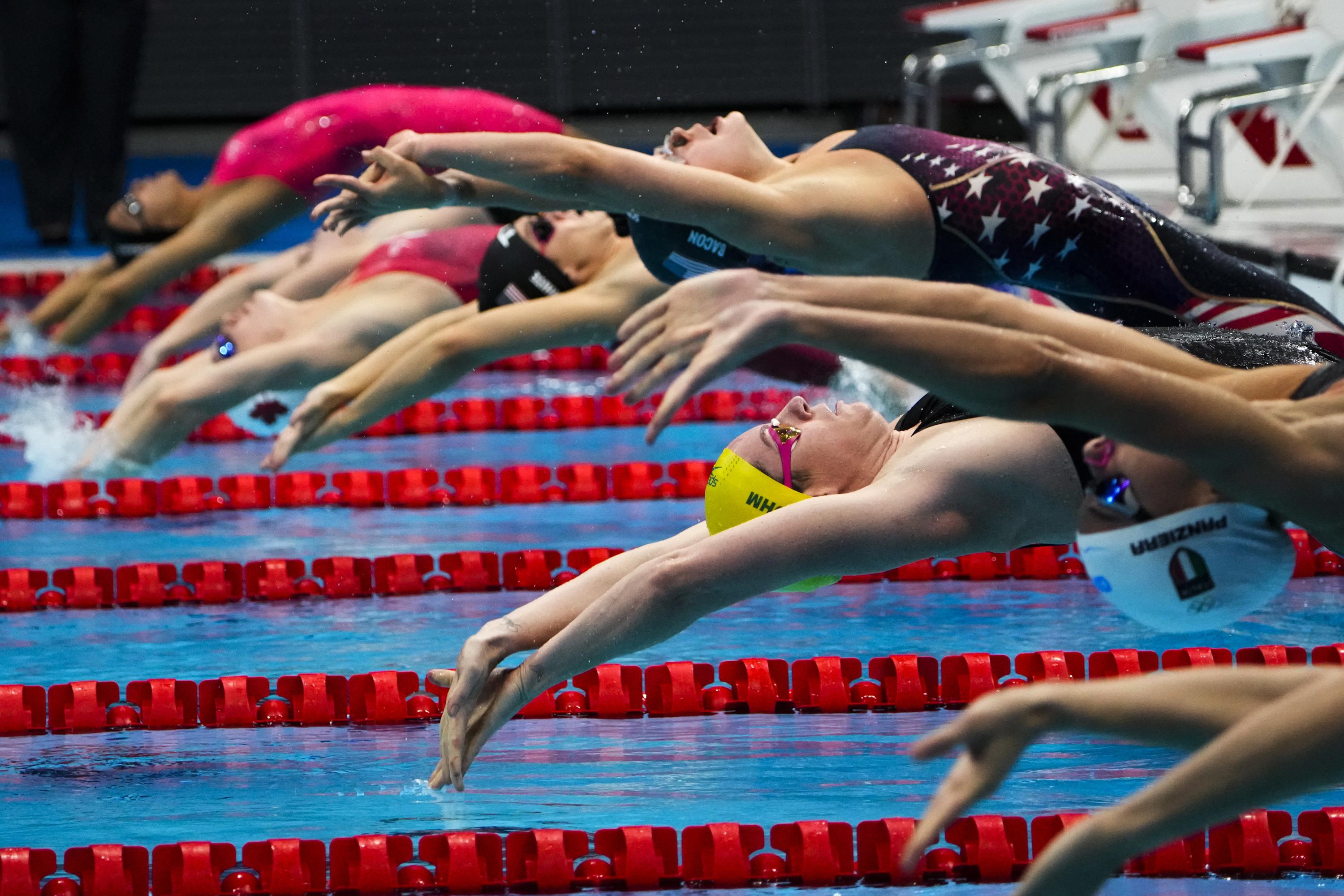 GLIMPSES Olympic swimmers, reaching for victory AP News