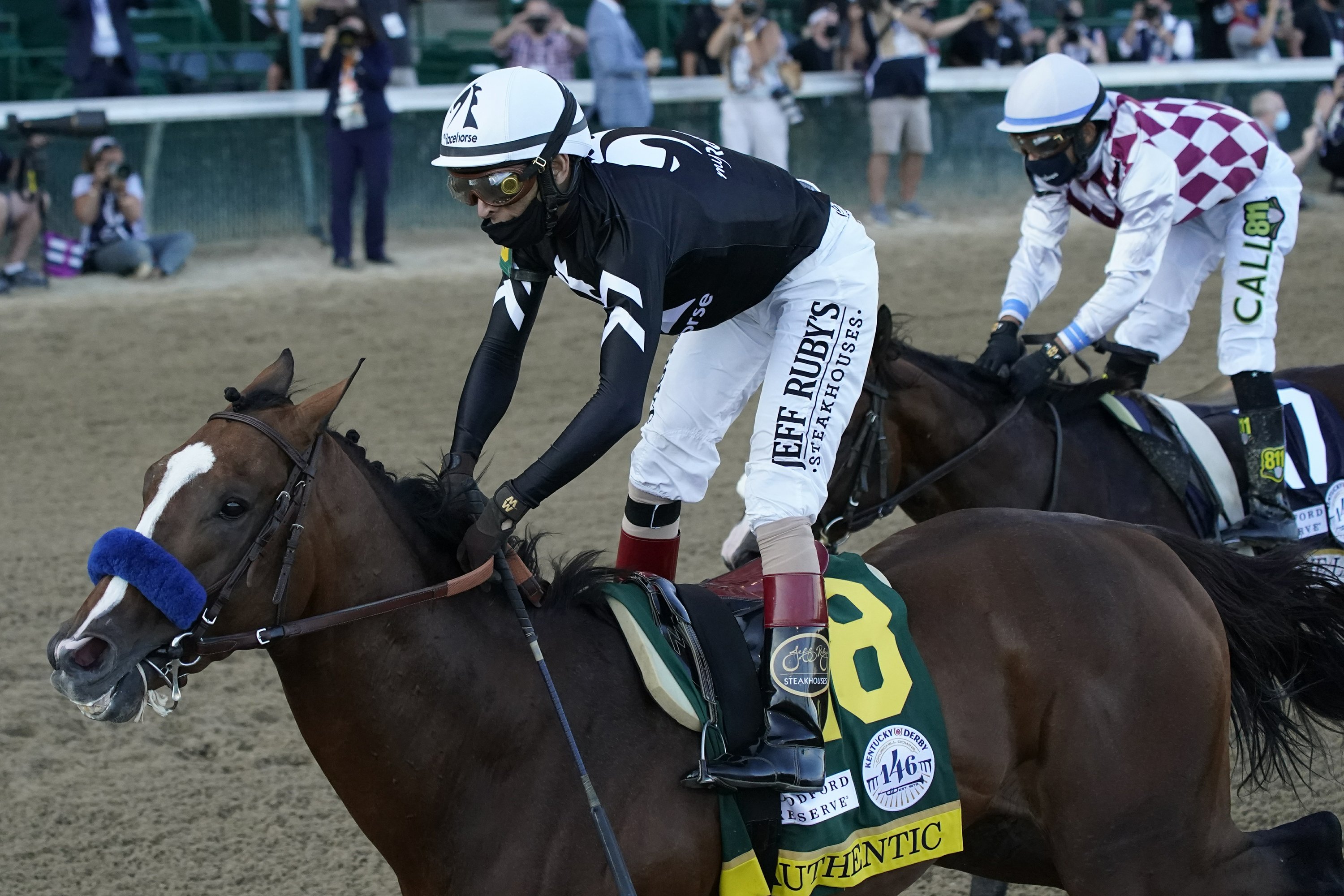 The Latest: Authentic goes wire to wire to win Ky. Derby