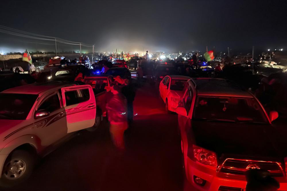 Afghan military and officials leave Kandahar city during fighting between the Taliban and Afghan security personnel, in Kandahar, southwest of Kabul, Afghanistan, Thursday, Aug. 12, 2021. (AP Photo/Sidiqullah Khan)