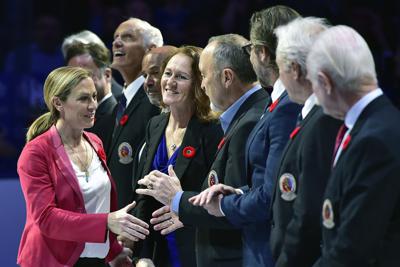 FILE - In this Nov. 9, 2018, file photo, Hockey Hall of Fame inductee Jayna Hefford shakes hands with people associated with the hall before a hockey game between the Toronto Maple Leafs and the New Jersey Devils in Toronto. Two officials with direct knowledge of discussions tell The Association Press that talks with select NHL teams and major corporate sponsors have intensified in the Professional Women’s Hockey Players’ Association’s bid to form a pro league within the next calendar year. In a text to The AP, PWHPA executive Jayna Hefford would only say she is not in a position to comment at this point. (Frank Gunn/The Canadian Press via AP, File)