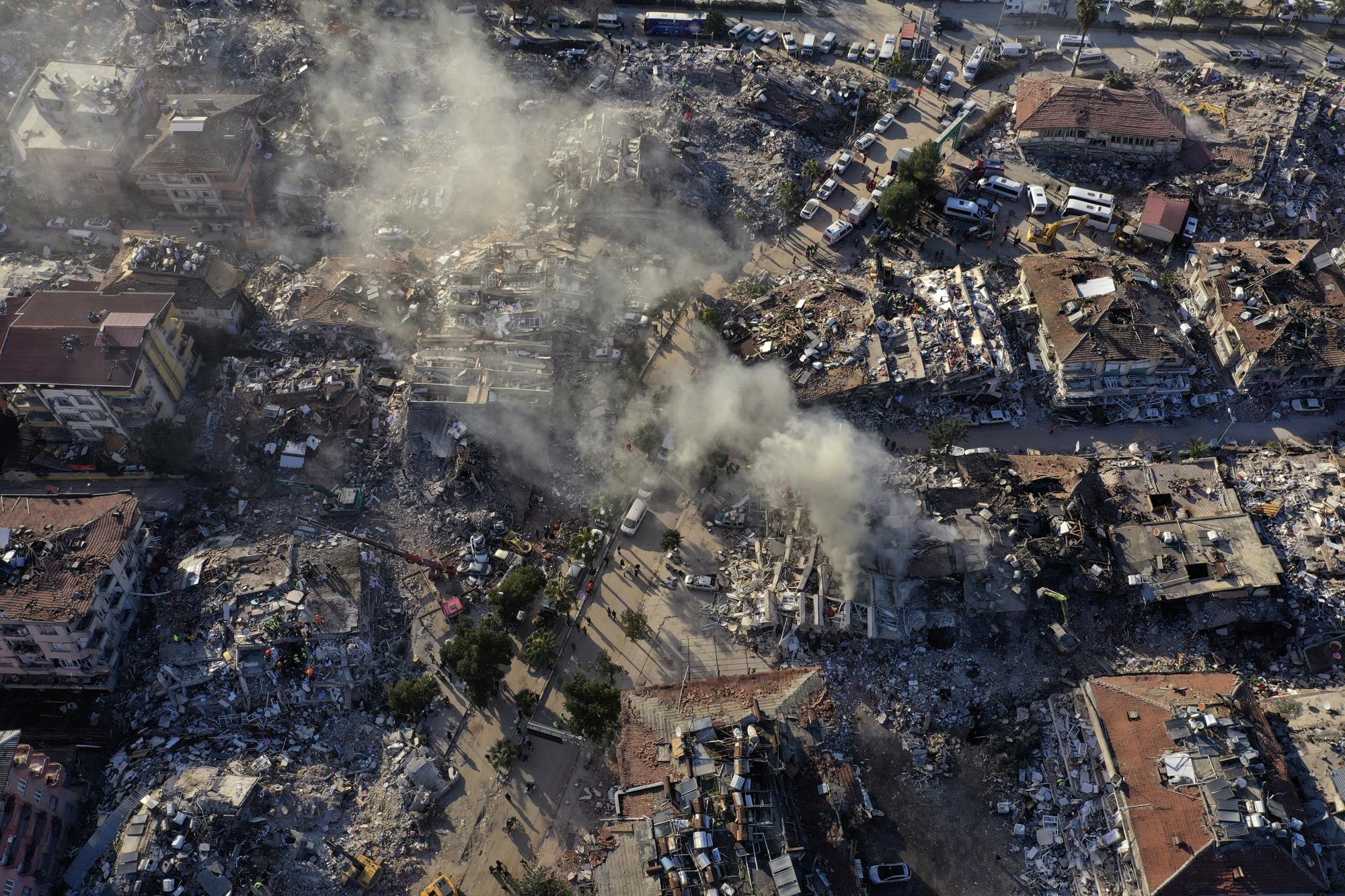 FILE - Destroyed buildings are seen from above in Antakya, southeastern Turkey, Thursday, Feb. 9, 2023. The 2011 quake, tsunami and nuclear meltdown in northern Japan provides a glimpse of what Turkey and Syria could face in the years ahead. No two events are alike, but the recent disaster resembles Japan's in the sheer enormity of the psychological trauma, of the loss of life and of the material destruction. (AP Photo/Hussein Malla, File)