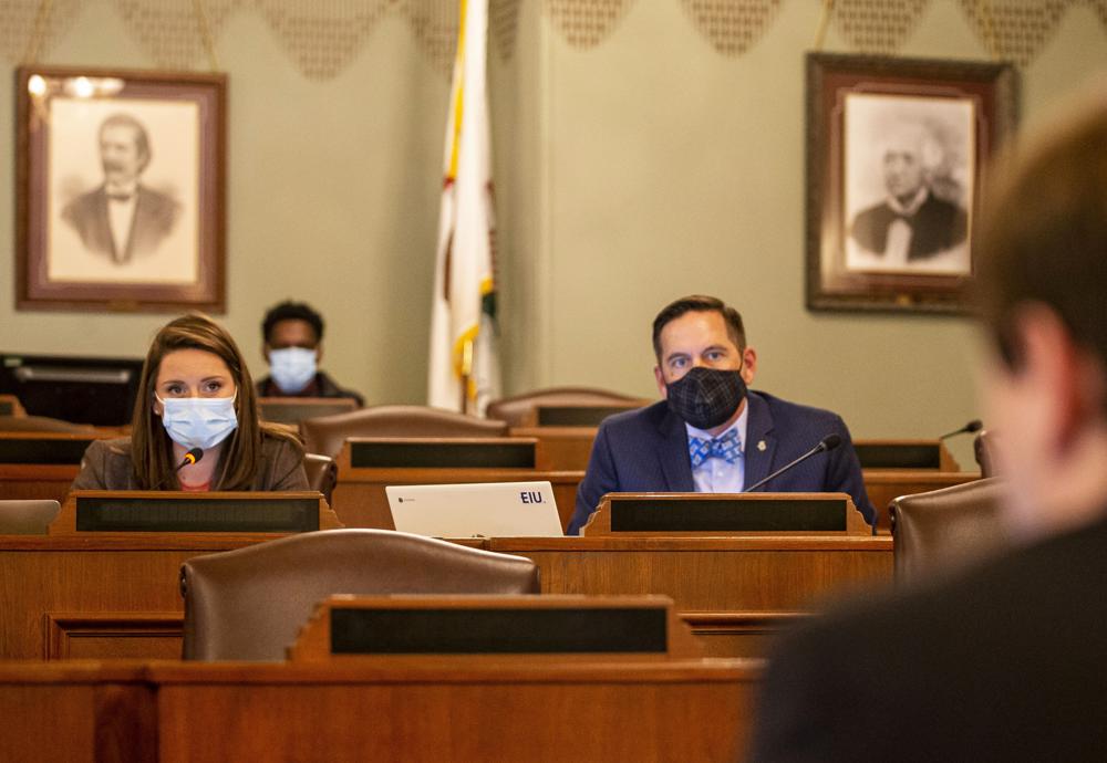 FILE - Illinois State Rep. Avery Bourne, R-Morrisonville, and Illinois State Rep. Tim Butler, R-Springfield, listen to testimony from Andrew Ellison during a House Redistricting Committee hearing at the Illinois State Capitol in Springfield, Ill., Wednesday, Oct. 20, 2021. Democratic Gov. J.B. Pritzker signed Illinois' new congressional district map into law Tuesday, Nov. 23, formalizing political boundaries drawn to help Democrats in next year's midterm elections, when Republicans are well positioned to win control of the U.S. House of Representatives. (Justin L. Fowler/The State Journal-Register via AP, File)