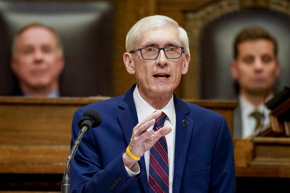 Wisconsin Gov. Tony Evers addresses a joint session of the Legislature in the Assembly chambers during the governor's State of the State speech at the state Capitol Tuesday, Feb. 15, 2022, in Madison, Wis. Behind Evers is Assembly Speaker Robin Vos, left, R-Rochester, and Senate President Chris Kapenga, R-Delafield. (AP Photo/Andy Manis)