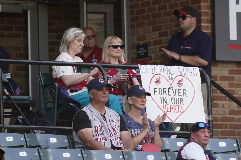 Cleveland Indians fans display a sign during a baseball game between the Kansas City Royals and the Cleveland Indians, Monday, Sept. 27, 2021, in Cleveland. Cleveland plays its final home game against the Royals as the Indians, the team's nickname since 1915. The club will be called the Cleveland Guardians next season. (AP Photo/Tony Dejak)